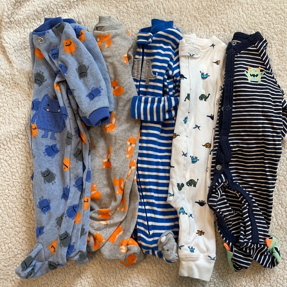 Five pairs of Carter’s new born pajamas